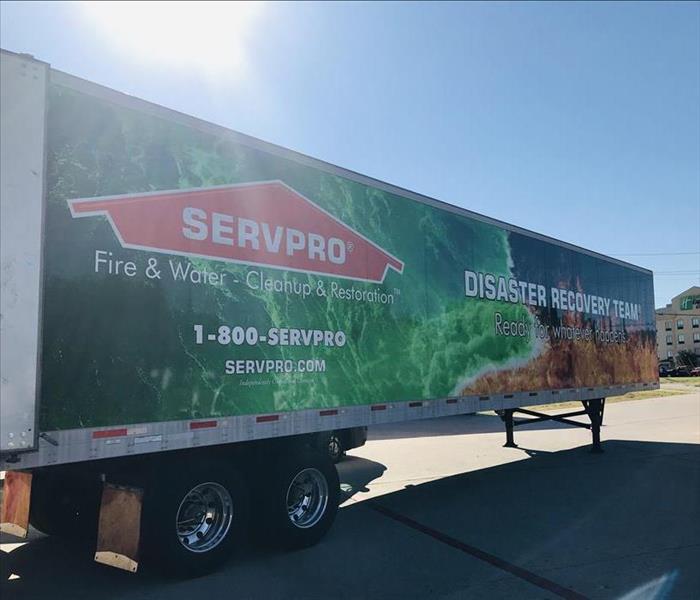 Trailer with SERVPRO logo and white lettering reading "Disaster Recovery Team"
