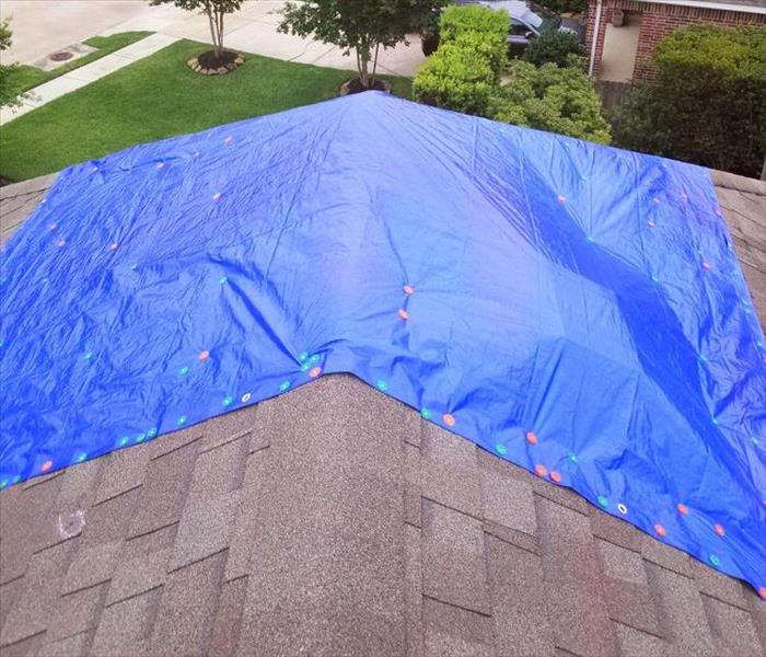 Blue tarp on roof 
