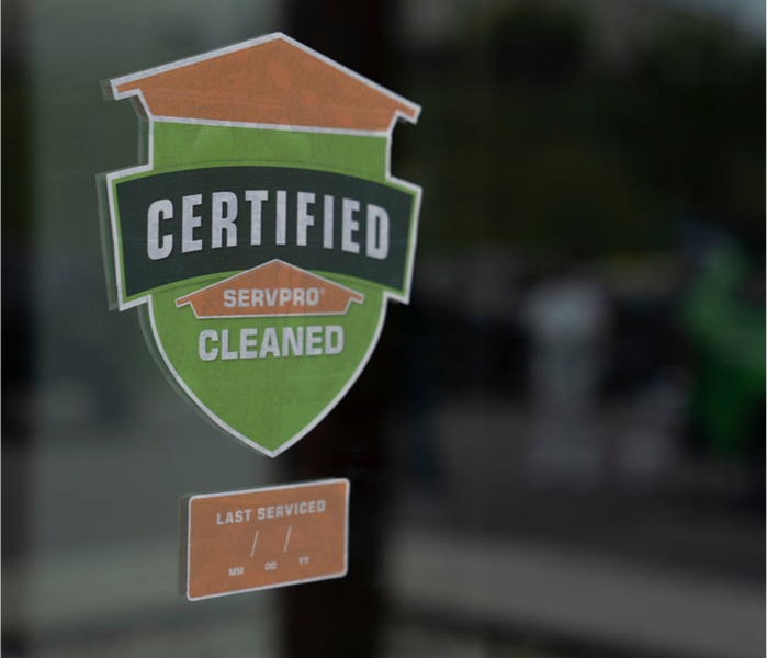 Certified: SERVPRO Cleaned Sticker Stuck Proudly to a Storefront Window