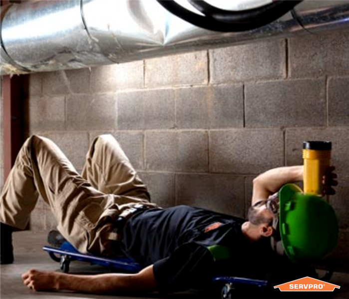 SERVPRO expert examining an air duct at a commercial property